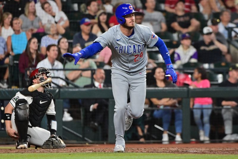 Apr 17, 2024; Phoenix, Arizona, USA;  Chicago Cubs outfielder Cody Bellinger (24) hits a solo home run in the sixth inning against the Arizona Diamondbacks at Chase Field. Mandatory Credit: Matt Kartozian-USA TODAY Sports