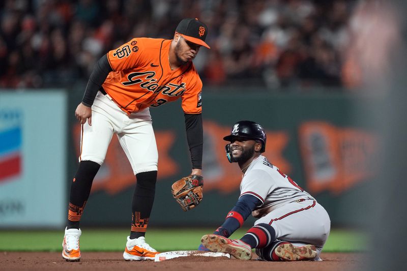 Aug 25, 2023; San Francisco, California, USA; Atlanta Braves center fielder Michael Harris II (23) reacts after stealing second base against San Francisco Giants second baseman Thairo Estrada (39) during the sixth inning at Oracle Park. Mandatory Credit: Darren Yamashita-USA TODAY Sports