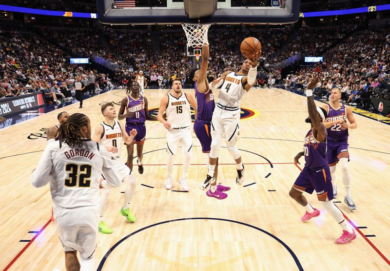 DENVER, COLORADO - OCTOBER 13: Russell Westbrook #4 of the Denver Nuggets drives to the basket against the Phoenix Suns in the second half at Ball Arena on October 13, 2024 in Denver, Colorado. NOTE TO USER: User expressly acknowledges and agrees that, by downloading and/or using this Photograph, user is consenting to the terms and conditions of the Getty Images License Agreement. (Photo by Jamie Schwaberow/Getty Images)