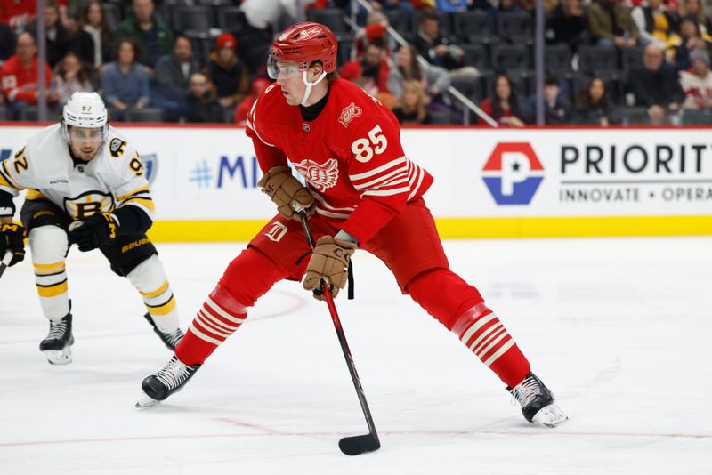 Dec 2, 2025; Detroit, Michigan, USA;  Detroit Red Wings left wing Elmer Soderblom (85) skates with the puck in the second period against the Boston Bruins at Little Caesars Arena. Mandatory Credit: Rick Osentoski-Imagn Images