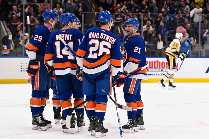 Apr 17, 2024; Elmont, New York, USA;  New York Islanders center Kyle Palmieri (21) celebrates his goal with right wing Oliver Wahlstrom (26) against the Pittsburgh Penguins during the second period at UBS Arena. Mandatory Credit: Dennis Schneidler-USA TODAY Sports