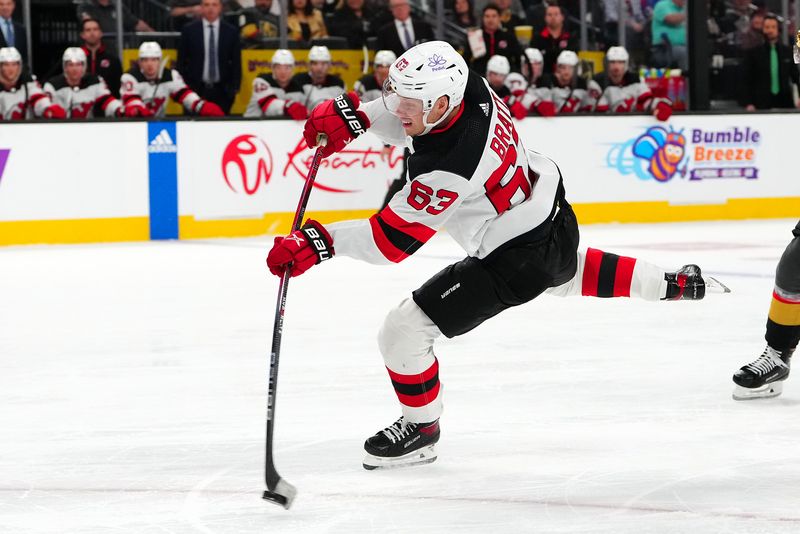 Mar 17, 2024; Las Vegas, Nevada, USA; New Jersey Devils left wing Jesper Bratt (63) shoots against the Vegas Golden Knights at T-Mobile Arena. Mandatory Credit: Stephen R. Sylvanie-USA TODAY Sports