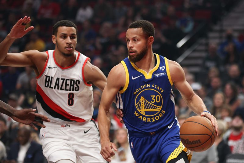 PORTLAND, OREGON - APRIL 11: Stephen Curry #30 of the Golden State Warriors drives against Kris Murray #8 of the Portland Trail Blazers during the first quarter at Moda Center on April 11, 2024 in Portland, Oregon. NOTE TO USER: User expressly acknowledges and agrees that, by downloading and or using this photograph, User is consenting to the terms and conditions of the Getty Images License Agreement.? (Photo by Amanda Loman/Getty Images)