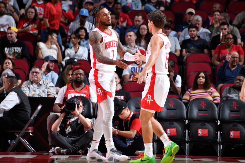 HOUSTON, TX - OCTOBER 15: Cam Whitmore #7 and Reed Sheppard #15 of the Houston Rockets high five during the game against the New Orleans Pelicans during a NBA preseason game on October 15, 2024 at the Toyota Center in Houston, Texas. NOTE TO USER: User expressly acknowledges and agrees that, by downloading and or using this photograph, User is consenting to the terms and conditions of the Getty Images License Agreement. Mandatory Copyright Notice: Copyright 2024 NBAE (Photo by Logan Riely/NBAE via Getty Images)