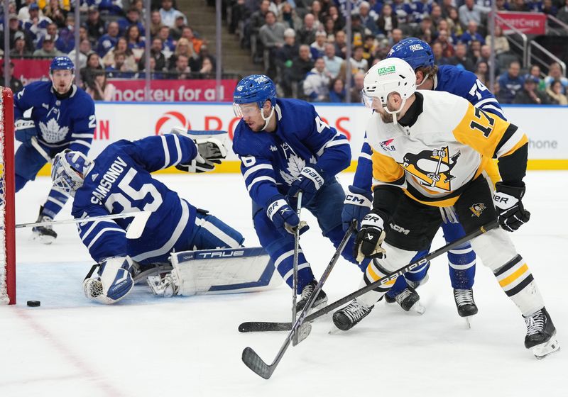 Apr 8, 2024; Toronto, Ontario, CAN; Pittsburgh Penguins right wing Bryan Rust (17) battles for the puck with Toronto Maple Leafs defenseman Ilya Lyubushkin (46) in front of goaltender Ilya Samsonov (35) during the second period at Scotiabank Arena. Mandatory Credit: Nick Turchiaro-USA TODAY Sports