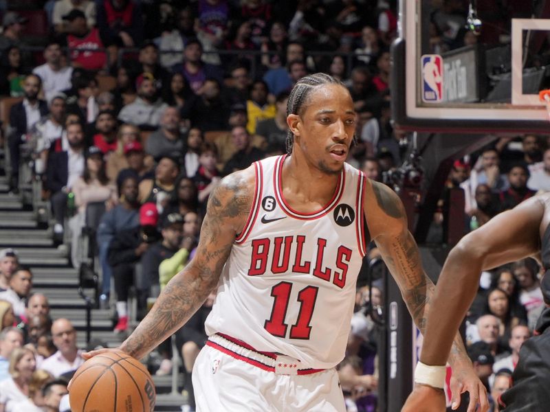 TORONTO, CANADA - APRIL 12:  DeMar DeRozan #11 of the Chicago Bulls dribbles the ball against the Toronto Raptors during the 2023 Play-In Tournament on April 12, 2023 at the Scotiabank Arena in Toronto, Ontario, Canada.  NOTE TO USER: User expressly acknowledges and agrees that, by downloading and or using this Photograph, user is consenting to the terms and conditions of the Getty Images License Agreement.  Mandatory Copyright Notice: Copyright 2022 NBAE (Photo by Mark Blinch/NBAE via Getty Images)