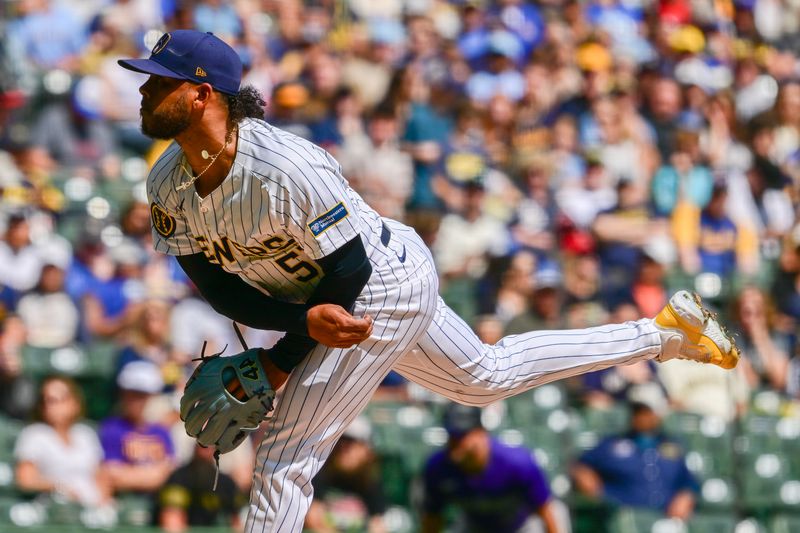 Sep 8, 2024; Milwaukee, Wisconsin, USA; Milwaukee Brewers starting pitcher Freddy Peralta (51) pitches in the first inning against the Colorado Rockies at American Family Field. Mandatory Credit: Benny Sieu-Imagn Images