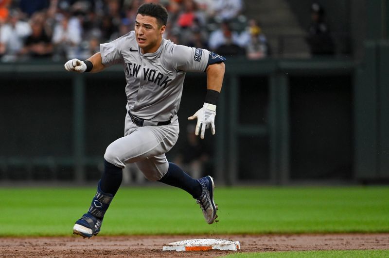 Jul 12, 2024; Baltimore, Maryland, USA;  New York Yankees shortstop Anthony Volpe (11) rounds second base on a fielding error during the second inningH at Oriole Park at Camden Yards. Mandatory Credit: Tommy Gilligan-USA TODAY Sports