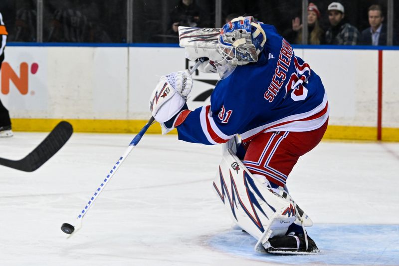 Jan 21, 2025; New York, New York, USA;  New York Rangers goaltender Igor Shesterkin (31) clears the puck against the Ottawa Senators during the third period at Madison Square Garden. Mandatory Credit: Dennis Schneidler-Imagn Images