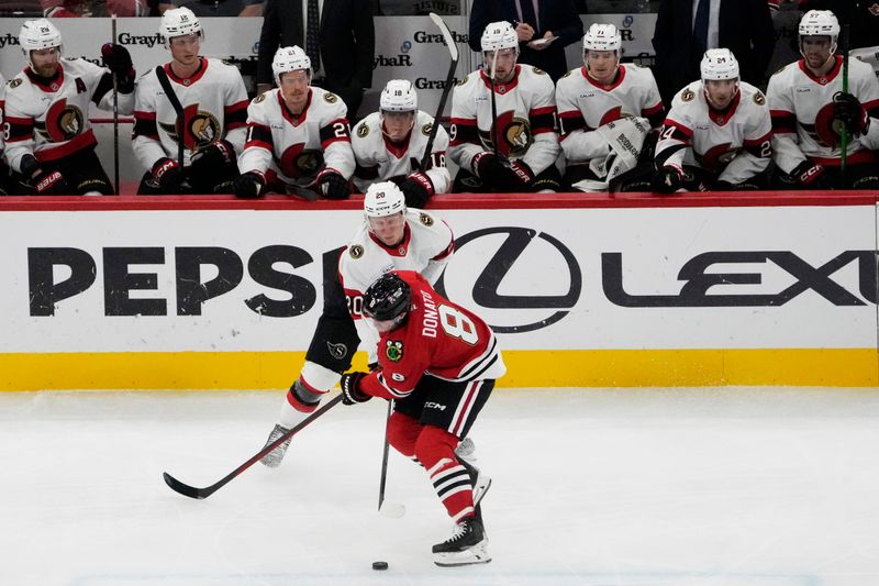 Oct 28, 2025; Chicago, Illinois, USA; Ottawa Senators left wing Fabian Zetterlund (20) defends Chicago Blackhawks center Ryan Donato (8) during the first period at United Center. Mandatory Credit: David Banks-Imagn Images