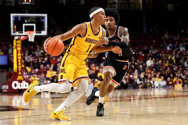 Dec 21, 2025; Minneapolis, Minnesota, USA; Minnesota Golden Gophers guard Isaac Asuma (1) works around Campbell Fighting Camels guard D.J. Smith (9) during the first half at Williams Arena. Mandatory Credit: Matt Krohn-Imagn Images