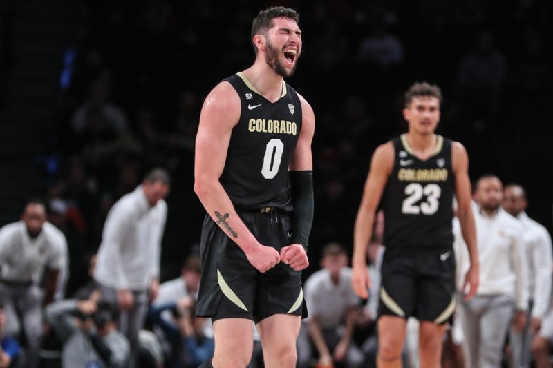 Dec 10, 2023; Brooklyn, New York, USA; Colorado Buffaloes guard Luke O'Brien (0) celebrates after scoring in the second half against the Miami (Fl) Hurricanes at Barclays Center. Mandatory Credit: Wendell Cruz-USA TODAY Sports