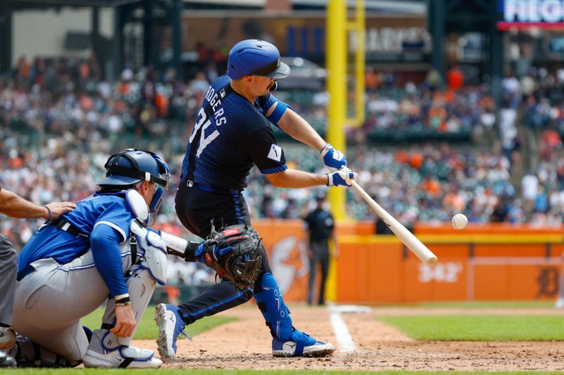 May 26, 2024; Detroit, Michigan, USA; Detroit Tigers catcher Jake Rogers (34) hits during an at bat in the third inning of the game against the Toronto Blue Jays at Comerica Park. Mandatory Credit: Brian Bradshaw Sevald-USA TODAY Sports