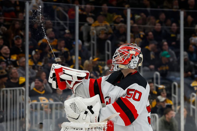 Jan 15, 2024; Boston, Massachusetts, USA; New Jersey Devils goaltender Nico Daws (50) squirts his water bottle before going for a drink during the first period against the Boston Bruins at TD Garden. Mandatory Credit: Winslow Townson-USA TODAY Sports