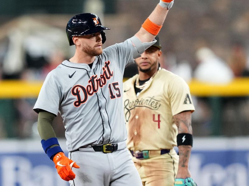 May 18, 2024; Phoenix, Arizona, USA; Detroit Tigers catcher Carson Kelly (15) reacts in front of Arizona Diamondbacks second base Ketel Marte (4) after hitting an RBI double during the seventh inning at Chase Field. Mandatory Credit: Joe Camporeale-USA TODAY Sports