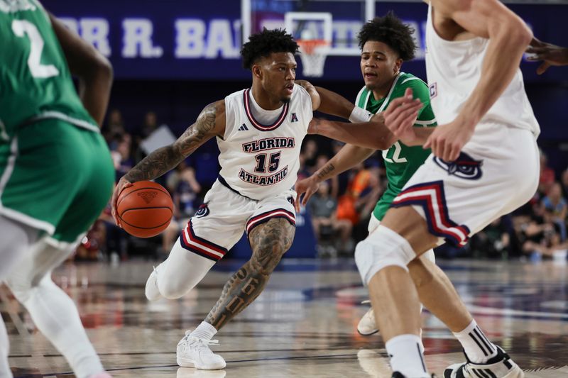 Jan 28, 2024; Boca Raton, Florida, USA; Florida Atlantic Owls guard Alijah Martin (15) drives to the basket against the North Texas Mean Green during the second half at Eleanor R. Baldwin Arena. Mandatory Credit: Sam Navarro-USA TODAY Sports