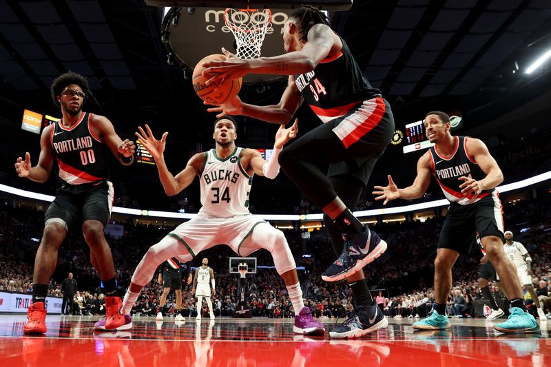 PORTLAND, OREGON - JANUARY 31: Giannis Antetokounmpo #34 of the Milwaukee Bucks defends Jabari Walker #34 of the Portland Trail Blazers during the third quarter at Moda Center on January 31, 2024 in Portland, Oregon. (Photo by Steph Chambers/Getty Images)