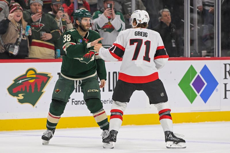 Dec 13, 2025; Saint Paul, Minnesota, USA;  Minnesota Wild forward Ryan Hartman (38) and Ottawa Senators forward Ridly Greig (71) fight during the second period at Grand Casino Arena. Mandatory Credit: Nick Wosika-Imagn Images