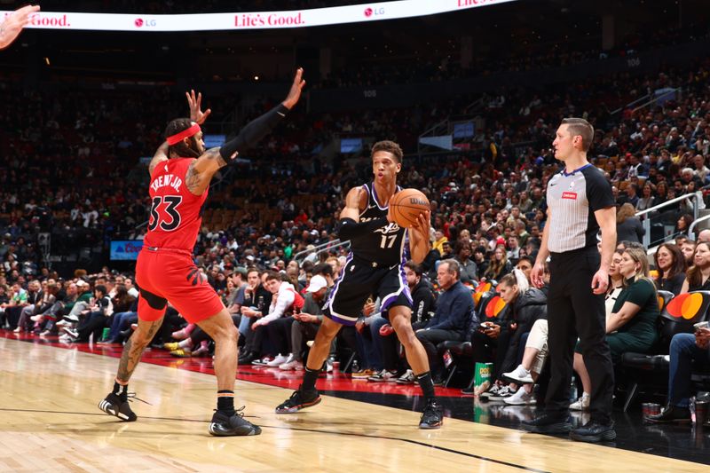 TORONTO, CANADA - MARCH 20: Kessler Edwards #17 of the Sacramento Kings looks to pass the ball during the game against the Toronto Raptors on March 20, 2024 at the Scotiabank Arena in Toronto, Ontario, Canada.  NOTE TO USER: User expressly acknowledges and agrees that, by downloading and or using this Photograph, user is consenting to the terms and conditions of the Getty Images License Agreement.  Mandatory Copyright Notice: Copyright 2024 NBAE (Photo by Vaughn Ridley/NBAE via Getty Images)