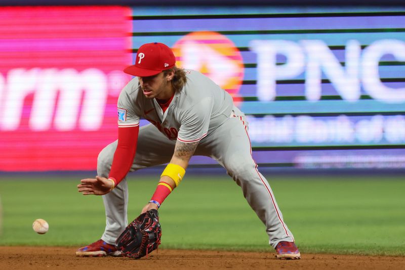 Sep 5, 2024; Miami, Florida, USA; Philadelphia Phillies second baseman Bryson Stott (5) catches a ground ball before throwing to first base to retire Miami Marlins left fielder Kyle Stowers (not pictured) during the fifth inning at loanDepot Park. Mandatory Credit: Sam Navarro-Imagn Images