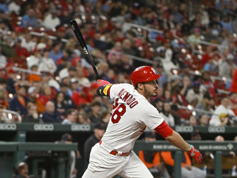 May 5, 2023; St. Louis, Missouri, USA;  St. Louis Cardinals third baseman Nolan Arenado (28) hits a single against the Detroit Tigers during the sixth inning at Busch Stadium. Mandatory Credit: Jeff Curry-USA TODAY Sports