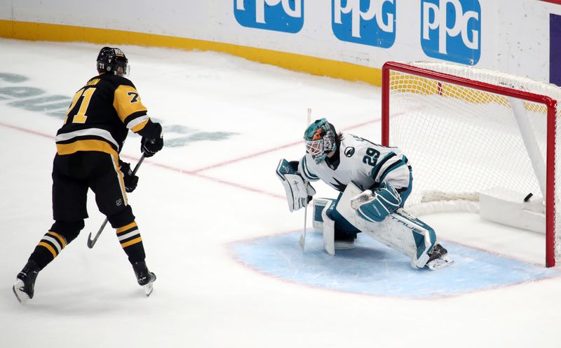 Nov 16, 2024; Pittsburgh, Pennsylvania, USA;  Pittsburgh Penguins center Evgeni Malkin (71) scores the game winning goal against San Jose Sharks goaltender Mackenzie Blackwood (29) in the shootout at PPG Paints Arena. Mandatory Credit: Charles LeClaire-Imagn Images