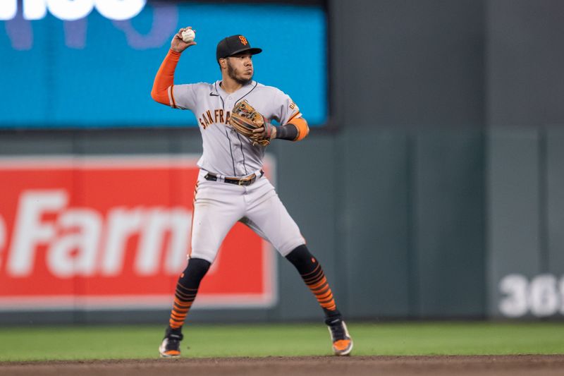 May 23, 2023; Minneapolis, Minnesota, USA; San Francisco Giants shortstop Thairo Estrada (39) throws to first base for an out in the eighth inning against the Minnesota Twins at Target Field. Mandatory Credit: Jesse Johnson-USA TODAY Sports