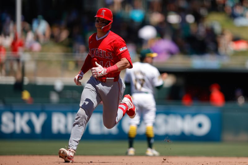 May 22, 2025; West Sacramento, California, USA; Los Angeles Angels catcher Logan O'Hoppe (14) runs the bases after hitting a one run home run during the seventh inning against the Athletics at Sutter Health Park. Mandatory Credit: Sergio Estrada-Imagn Images