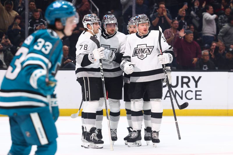 Dec 27, 2023; Los Angeles, California, USA; Los Angeles Kings center Pierre-Luc Dubois (80) celebrates with his teammates after scoring a gaol during the second period of a game against the San Jose Sharks at Crypto.com Arena. Mandatory Credit: Jessica Alcheh-USA TODAY Sports