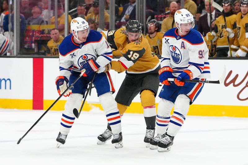 Apr 1, 2025; Las Vegas, Nevada, USA; Vegas Golden Knights right wing Reilly Smith (19) skates between Edmonton Oilers left wing Zach Hyman (18) and Edmonton Oilers center Ryan Nugent-Hopkins (93) during the first period at T-Mobile Arena. Mandatory Credit: Stephen R. Sylvanie-Imagn Images