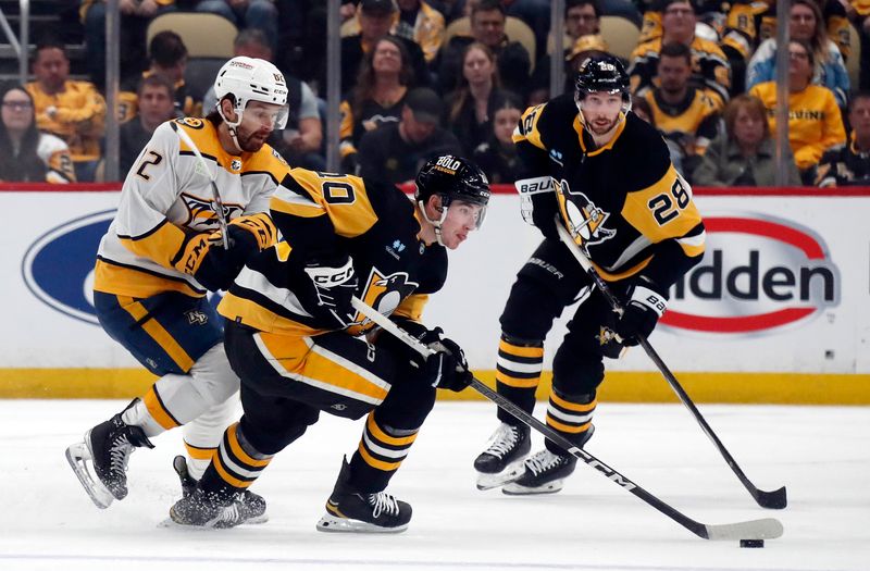 Apr 15, 2024; Pittsburgh, Pennsylvania, USA;  Pittsburgh Penguins left wing Drew O'Connor (10) moves the puck against Nashville Predators center Tommy Novak (82) during the first period at PPG Paints Arena. The Penguins won 4-2. Mandatory Credit: Charles LeClaire-USA TODAY Sports