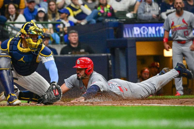 May 11, 2024; Milwaukee, Wisconsin, USA; St. Louis Cardinals catcher Ivan Herrera (48) scores against Milwaukee Brewers catcher William Contreras (24) in the sixth inning at American Family Field. Mandatory Credit: Benny Sieu-USA TODAY Sports