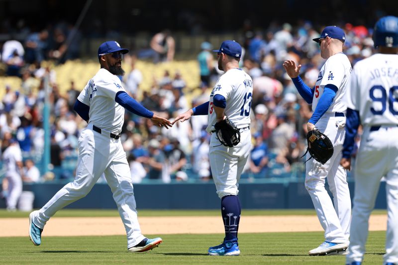 May 8, 2024; Los Angeles, California, USA;  Los Angeles Dodgers outfielder Teoscar Hernandez (37, L) celebrates a victory with third base Max Muncy (13) and first base Freddie Freeman (5) after defeating the Miami Marlins at Dodger Stadium. Mandatory Credit: Kiyoshi Mio-USA TODAY Sports