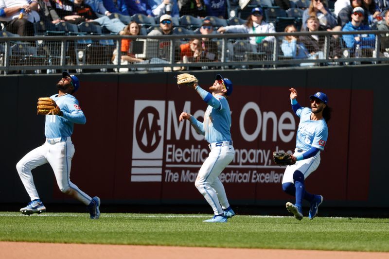 Apr 6, 2025; Kansas City, Missouri, USA; Kansas City Royals third base Maikel Garcia (11) Kansas City Royals shortstop Bobby Witt Jr. (7) and Kansas City Royals second base Jonathan India (6) merge on a pop fly at Kauffman Stadium. Mandatory Credit: Gary Rohman-Imagn Images