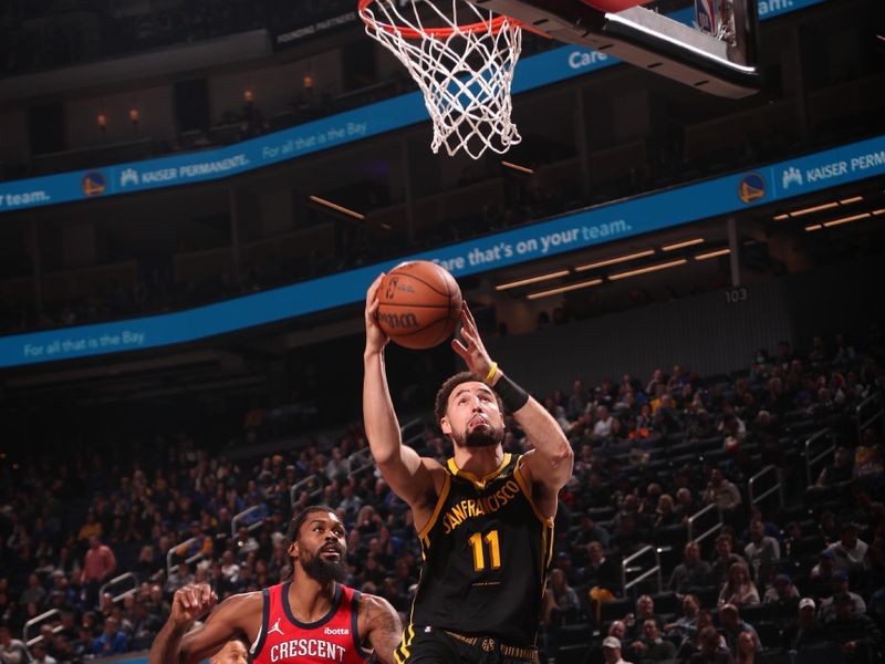 SAN FRANCISCO, CA - JANUARY 10: Klay Thompson #11 of the Golden State Warriors drives to the basket during the game against the New Orleans Pelicans on January 10, 2024 at Chase Center in San Francisco, California. NOTE TO USER: User expressly acknowledges and agrees that, by downloading and or using this photograph, user is consenting to the terms and conditions of Getty Images License Agreement. Mandatory Copyright Notice: Copyright 2024 NBAE (Photo by Jed Jacobsohn/NBAE via Getty Images)