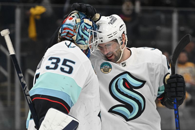 Feb 15, 2024; Boston, Massachusetts, USA; Seattle Kraken goaltender Joey Daccord (35) reacts with defenseman Justin Schultz (4) after a game against the Boston Bruins at the TD Garden. Mandatory Credit: Brian Fluharty-USA TODAY Sports