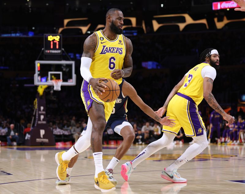 LOS ANGELES, CALIFORNIA - NOVEMBER 02: LeBron James #6 of the Los Angeles Lakers runs a pick and roll with Anthony Davis #3 past Trey Murphy III #25 of the New Orleans Pelicans during a 120-117 Lakers overtime win at Crypto.com Arena on November 02, 2022 in Los Angeles, California. NOTE TO USER: User expressly acknowledges and agrees that, by downloading and/or using this Photograph, user is consenting to the terms and conditions of the Getty Images License Agreement. Mandatory Copyright Notice: Copyright 2022 NBAE (Photo by Harry How/Getty Images)