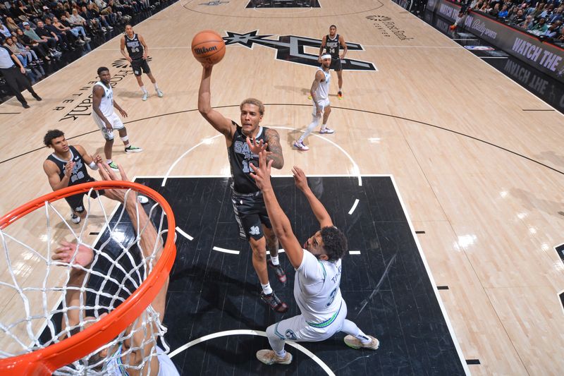 SAN ANTONIO, TX - JANUARY 27: Jeremy Sochan #10 of the San Antonio Spurs drives to the basket during the game against the Minnesota Timberwolves on January 27, 2024 at the Frost Bank Center in San Antonio, Texas. NOTE TO USER: User expressly acknowledges and agrees that, by downloading and or using this photograph, user is consenting to the terms and conditions of the Getty Images License Agreement. Mandatory Copyright Notice: Copyright 2024 NBAE (Photos by Michael Gonzales/NBAE via Getty Images)