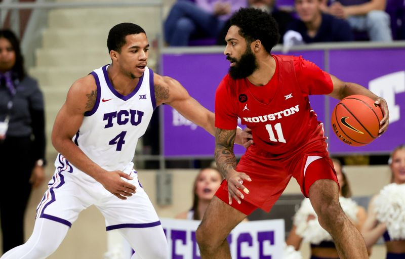 Jan 13, 2024; Fort Worth, Texas, USA;  Houston Cougars guard Damian Dunn (11) controls the ball as TCU Horned Frogs guard Jameer Nelson Jr. (4) defends during the first half at Ed and Rae Schollmaier Arena. Mandatory Credit: Kevin Jairaj-USA TODAY Sports