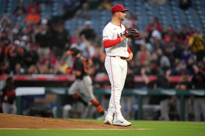 Apr 22, 2024; Anaheim, California, USA; Los Angeles Angels pitcher Reid Detmers (48) reacts after surrendering a solo home run to Baltimore Orioles catcher James McCann (27) in the second inning at Angel Stadium. Mandatory Credit: Kirby Lee-USA TODAY Sports