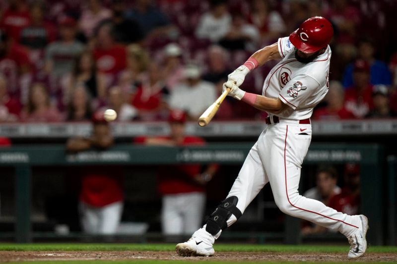 Sep 6, 2023; Cincinnati, Ohio, USA; Cincinnati Reds left fielder Nick Martini (23) hits a base hit in the eighth inning of the MLB baseball game between the Cincinnati Reds and the Seattle Mariners at Great American Ball Park. Mandatory Credit: Albert Cesare-USA TODAY Sports