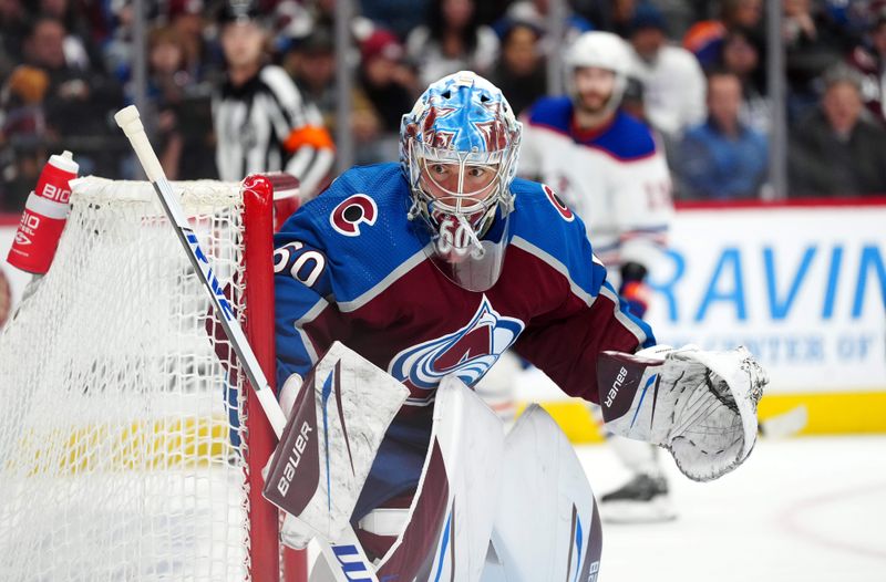 Apr 18, 2024; Denver, Colorado, USA; Colorado Avalanche goaltender Justus Annunen (60) defends the net in the third period against the Edmonton Oilers at Ball Arena. Mandatory Credit: Ron Chenoy-USA TODAY Sports