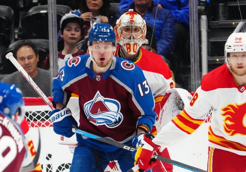 Dec 11, 2023; Denver, Colorado, USA; Colorado Avalanche right wing Valeri Nichushkin (13) shields Calgary Flames goaltender Dan Vladar (80) in the first period at Ball Arena. Mandatory Credit: Ron Chenoy-USA TODAY Sports