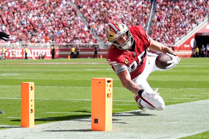 San Francisco 49ers tight end George Kittle (85) falls out of bounds during the first half of an NFL football game against the Arizona Cardinals in Santa Clara, Calif., Sunday, Oct. 6, 2024. (AP Photo/Godofredo A. Vásquez)