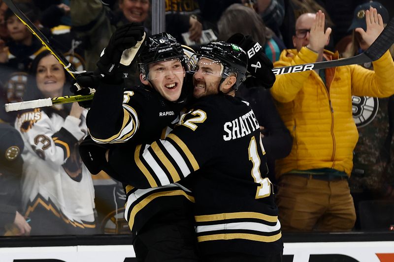 Feb 29, 2024; Boston, Massachusetts, USA; Boston Bruins defenseman Mason Lohrei (6) celebrates his winning goal against the Vegas Golden Knights with defenseman Kevin Shattenkirk (12) during the third period of their 5-4 win at TD Garden. Mandatory Credit: Winslow Townson-USA TODAY Sports