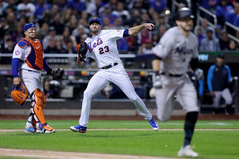 Sep 28, 2023; New York City, New York, USA; New York Mets starting pitcher David Peterson (23) throws out Miami Marlins shortstop Garrett Hampson (1) at first base on an infield ground ball during the sixth inning at Citi Field. Mandatory Credit: Brad Penner-USA TODAY Sports