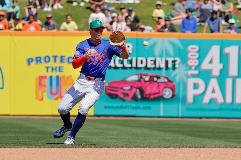 Mar 17, 2025; Port St. Lucie, Florida, USA;  New York Mets third base Brett Baty (7) catches a ground ball hopper during the seventh inning against the Tampa Bay Rays at Clover Park. Mandatory Credit: Reinhold Matay-Imagn Images. 