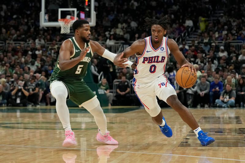 MILWAUKEE, WISCONSIN - OCTOBER 26: Tyrese Maxey #0 of the Philadelphia 76ers dribbles the ball against Malik Beasley #5 of the Milwaukee Bucks in the second half at Fiserv Forum on October 26, 2023 in Milwaukee, Wisconsin. NOTE TO USER: User expressly acknowledges and agrees that, by downloading and or using this photograph, User is consenting to the terms and conditions of the Getty Images License Agreement. (Photo by Patrick McDermott/Getty Images)