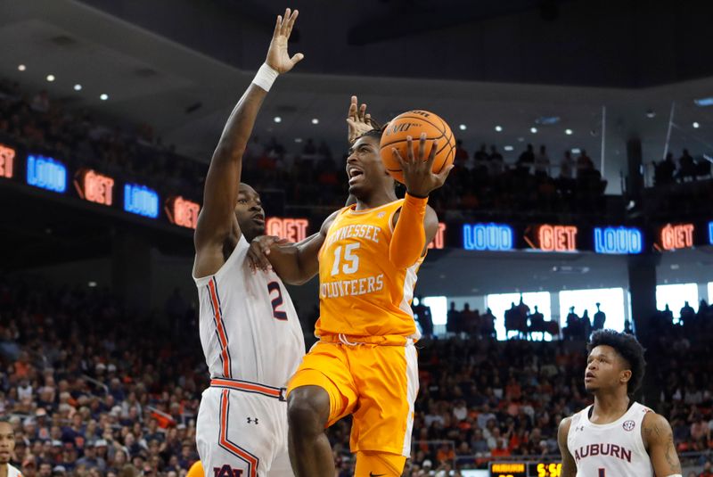 Mar 4, 2023; Auburn, Alabama, USA;   Tennessee Volunteers guard Jahmai Mashack (15) shoots the ball against Auburn Tigers forward Jaylin Williams (2) during the first half at Neville Arena. Mandatory Credit: John Reed-USA TODAY Sports