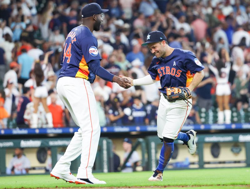 Jun 16, 2024; Houston, Texas, USA; Houston Astros second baseman Jose Altuve (27) and designated hitter Yordan Alverez (44) celebrate after defeating the Detroit Tigers at Minute Maid Park. Mandatory Credit: Thomas Shea-USA TODAY Sports